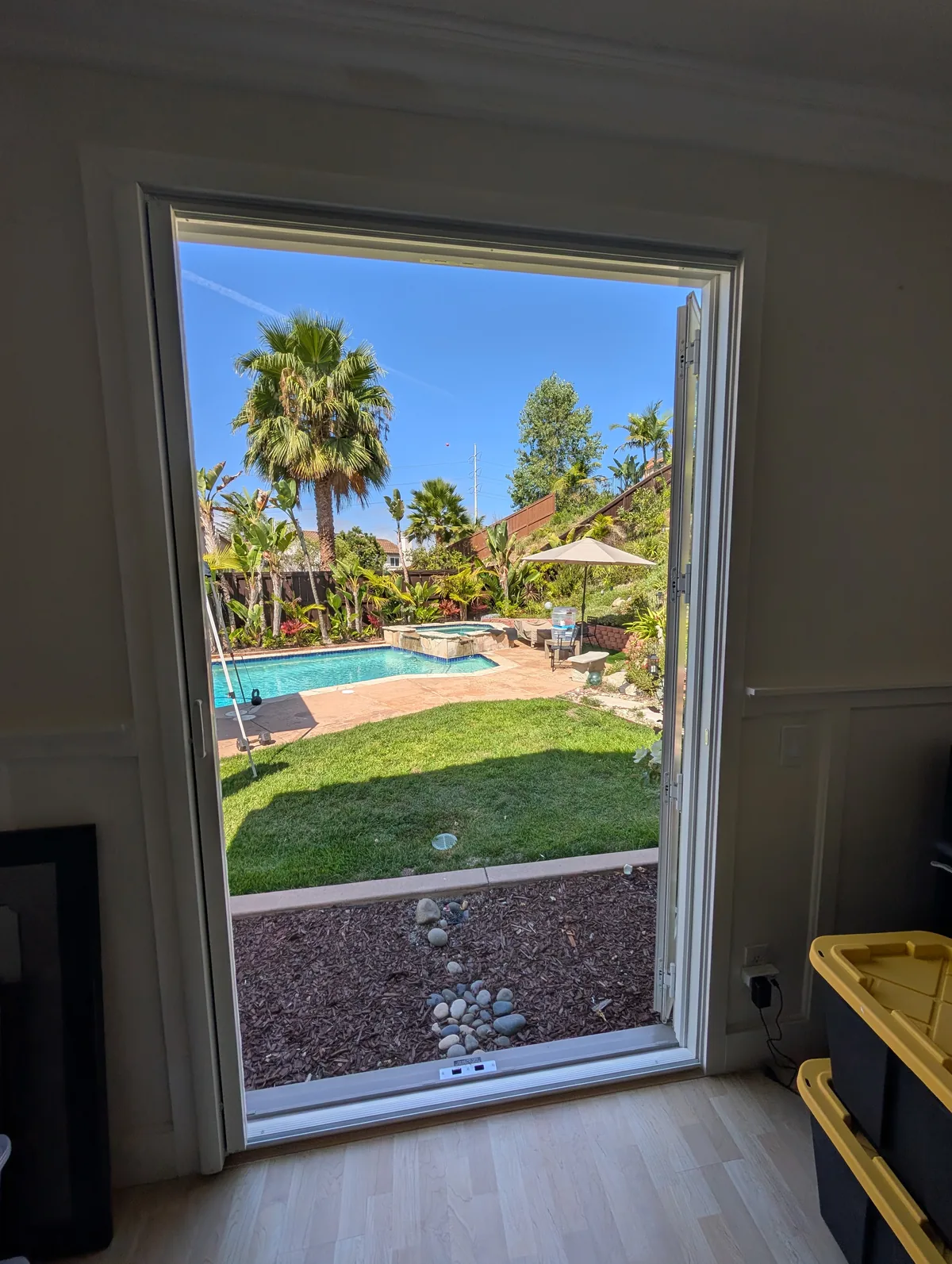 Retractable screen installed on an outswing French door opening to a pool, Carlsbad, CA