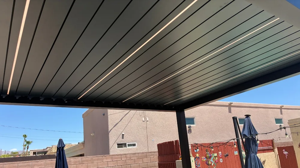 Atlas louvered patio cover with louvers open above an outdoor seating area in Lake Havasu City AZ