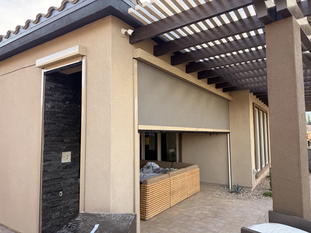 Motorized patio screen under a modern pergola